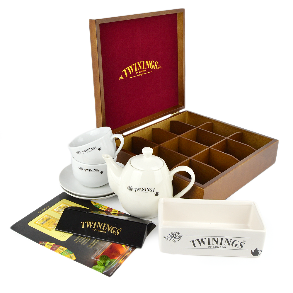 PZ 1 scatola da 12 scomparti + 2 tazzine con piattino Twinings + 1 teiera Twinings + 120 bustine con assortimento di the, tisane e camomille; e mini espositore Twinings